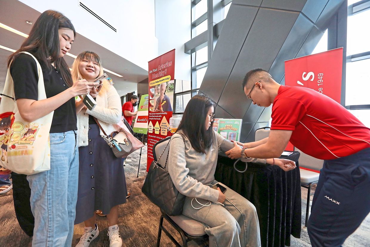 Visitors getting their blood pressure checked at Watsons’ Heart Health Workshop in Kuala Lumpur.