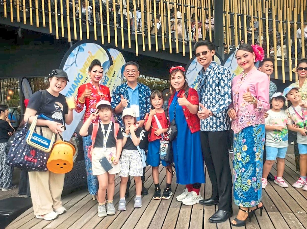 Wong (third from left) with the ‘kebaya’ and batik models from the fashion shows that were hot tickets at the World Expo 2025.