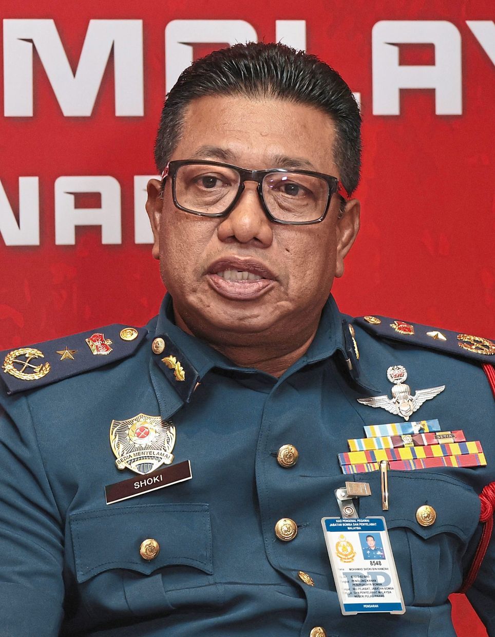 Ever-prepared: About 800 firemen are ready for deployment during the monsoon, says Mohamad Shoki. They include Lebuh Pantai station personnel (below). — CHAN BOON KAI/The Star