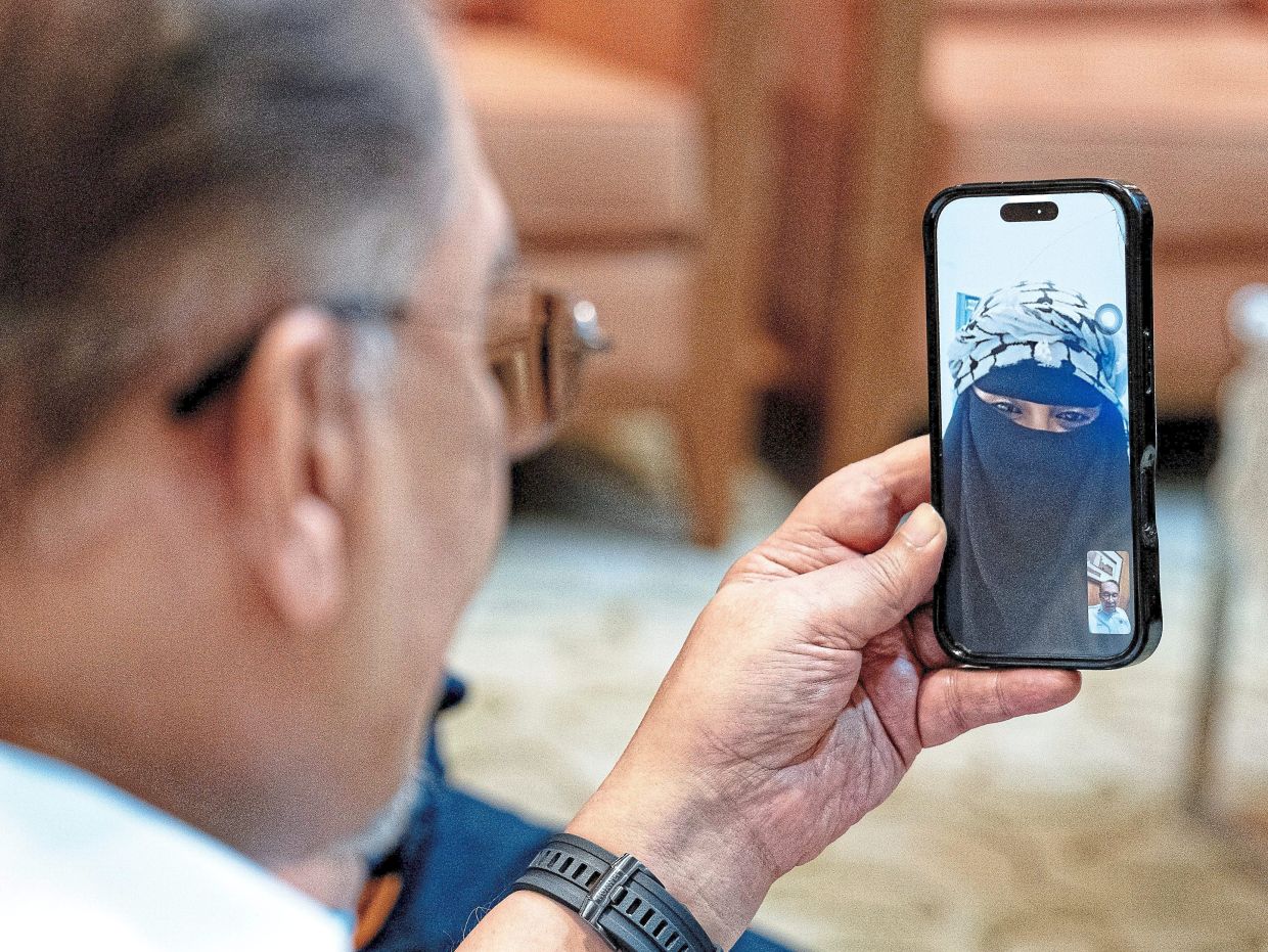 Checking in: Anwar having a video call with one of the Malaysian activists currently in Istanbul.