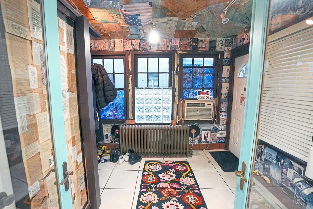 The foyer was a mish-mash of collages. — HGTV/TNS