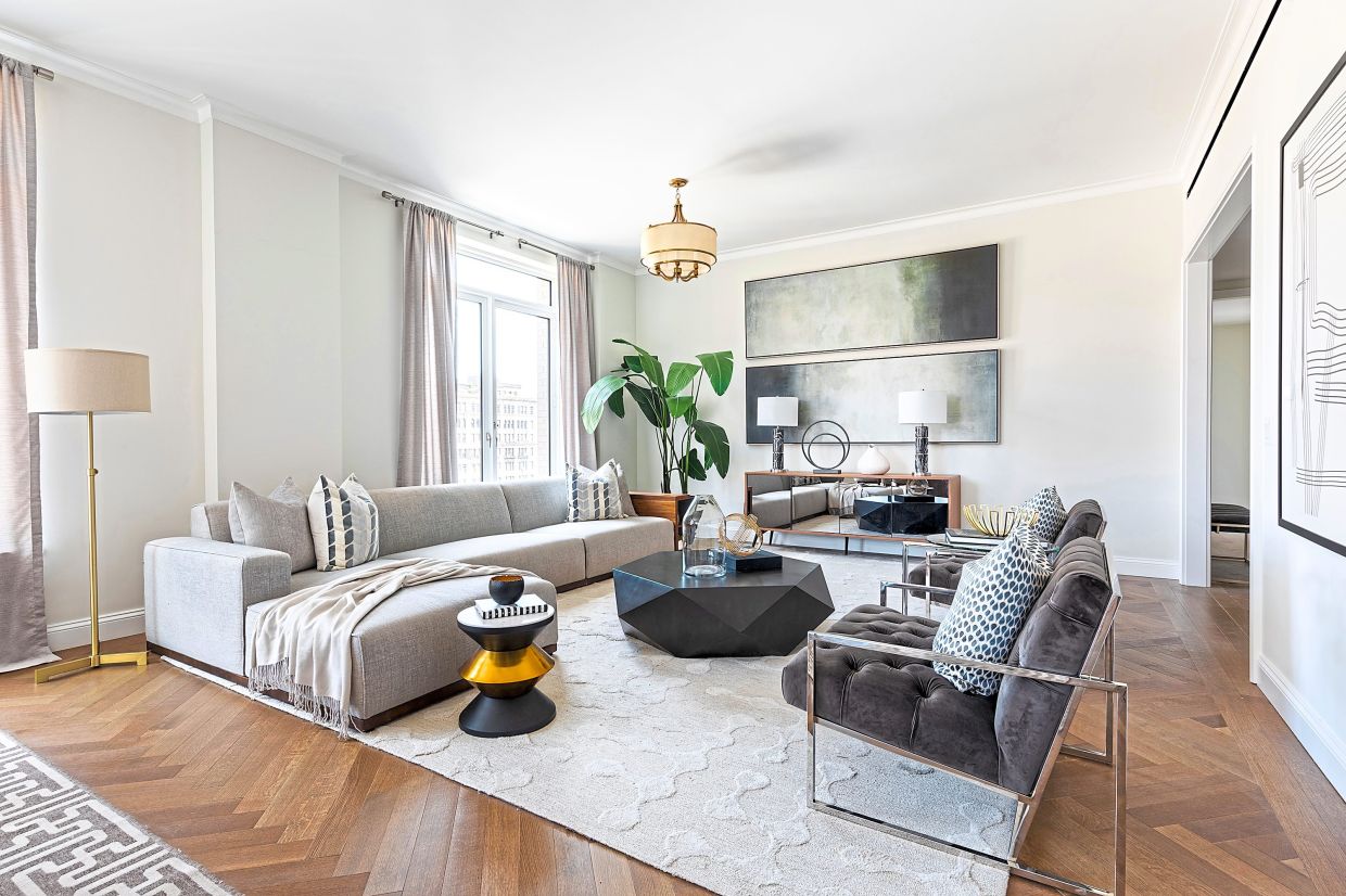 Two horizontal identical pieces of art help to elongate this living space.