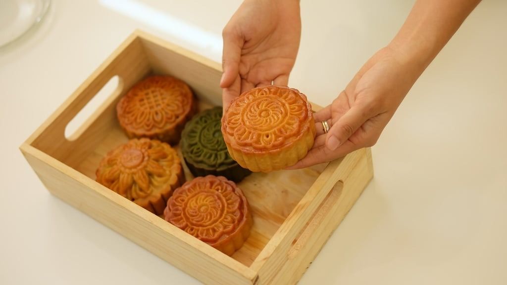 The essence of the mooncake is found in its filling: a sweet, velvety lotus seed paste enveloped by a thin, tender pastry skin. -- Photo: Shutterstock via SCMP