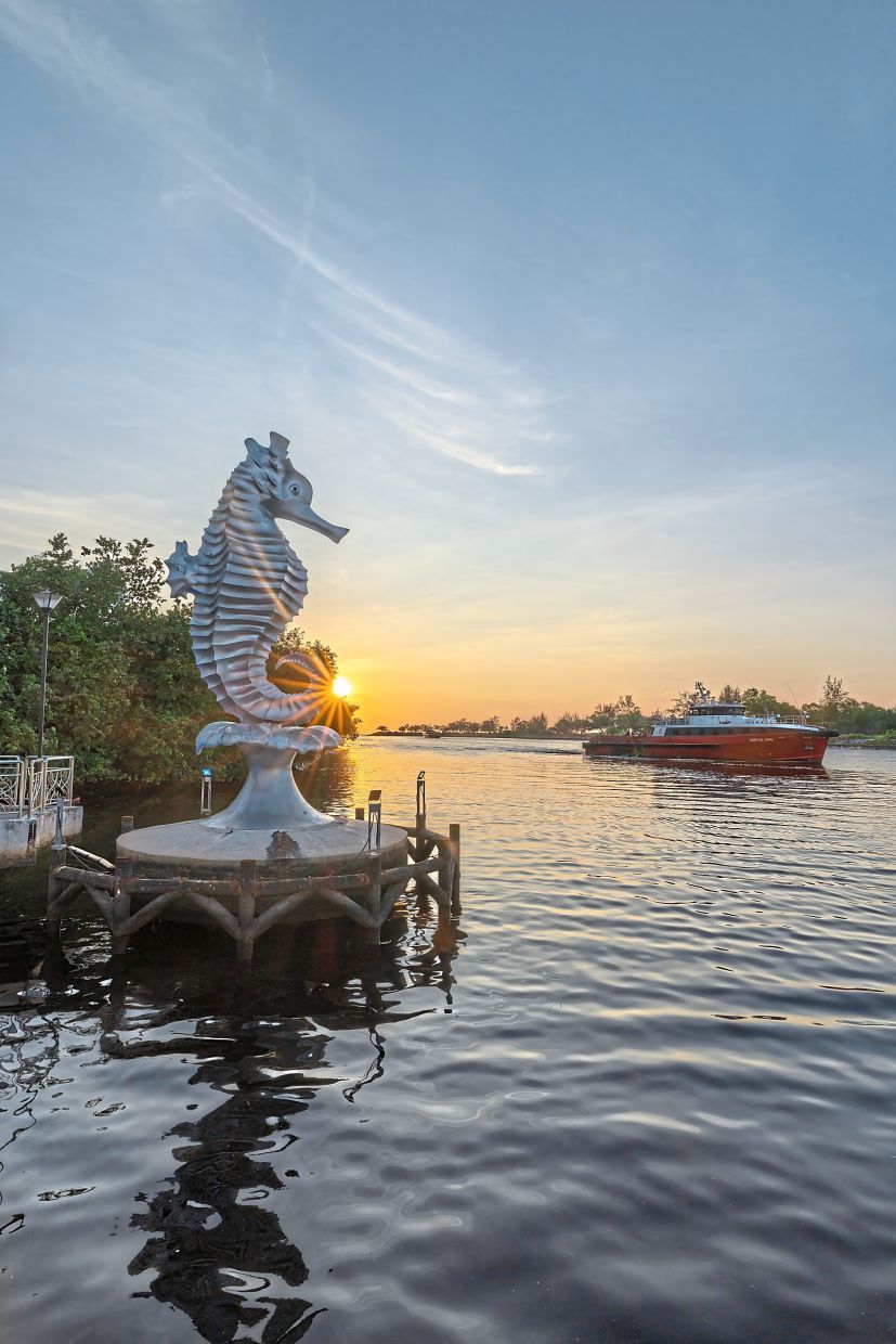 The iconic Seahorse of Miri, a symbol of the city by the sea, watching the waterfront at sunset.