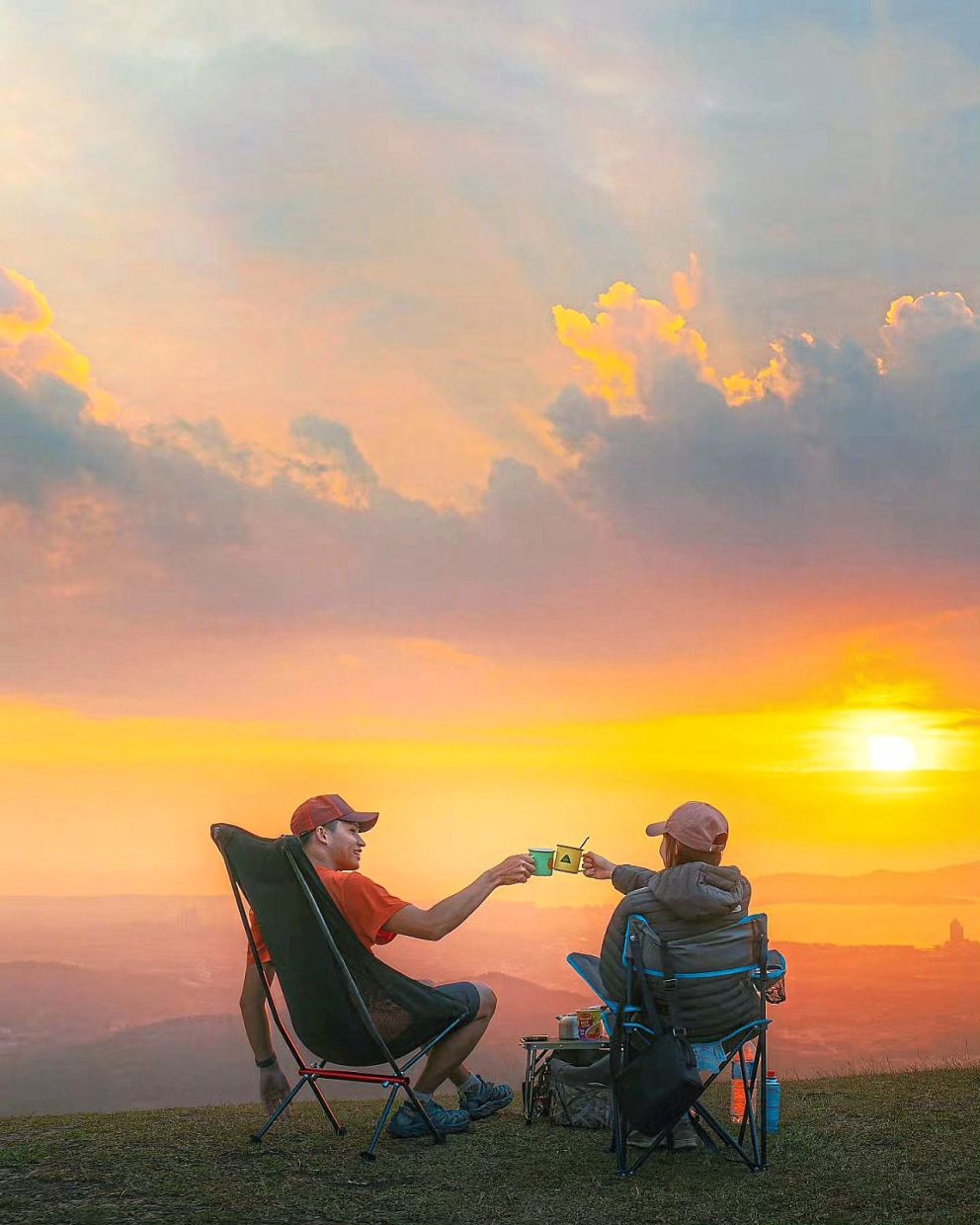 A quiet embrace at Kokol Hills, watching the sun set over Kota Kinabalu and the islands beyond.