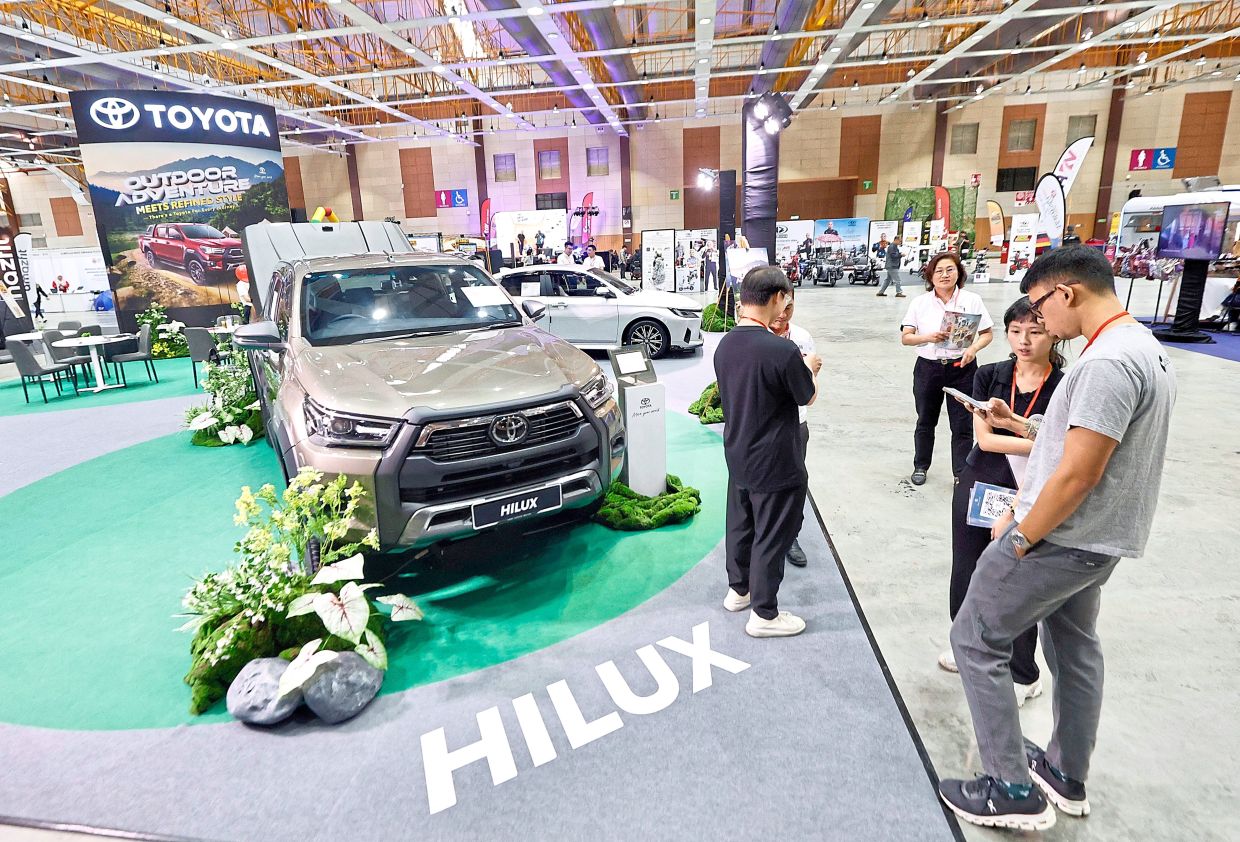 Toyota’s rugged Hilux taking centre stage at the expo, highlighting its reliability as an off-road companion to outdoor enthusiasts. — FAIHAN GHANI/The Star