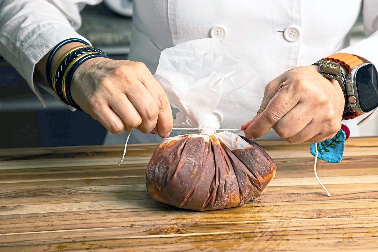 The nopales, salsa and pork are wrapped in wax paper and steamed for about two hours.