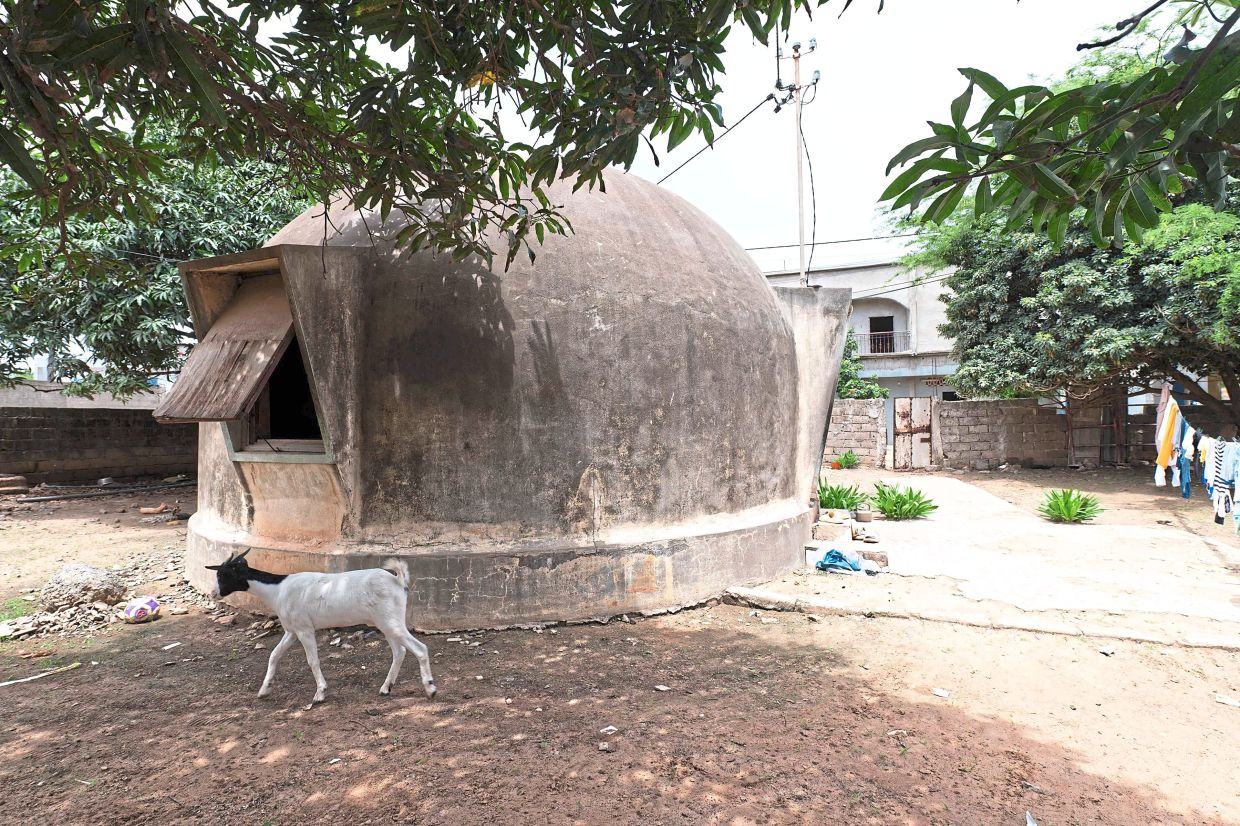 A general view of a bubble house standing in the corner of a courtyard in Ouakam.