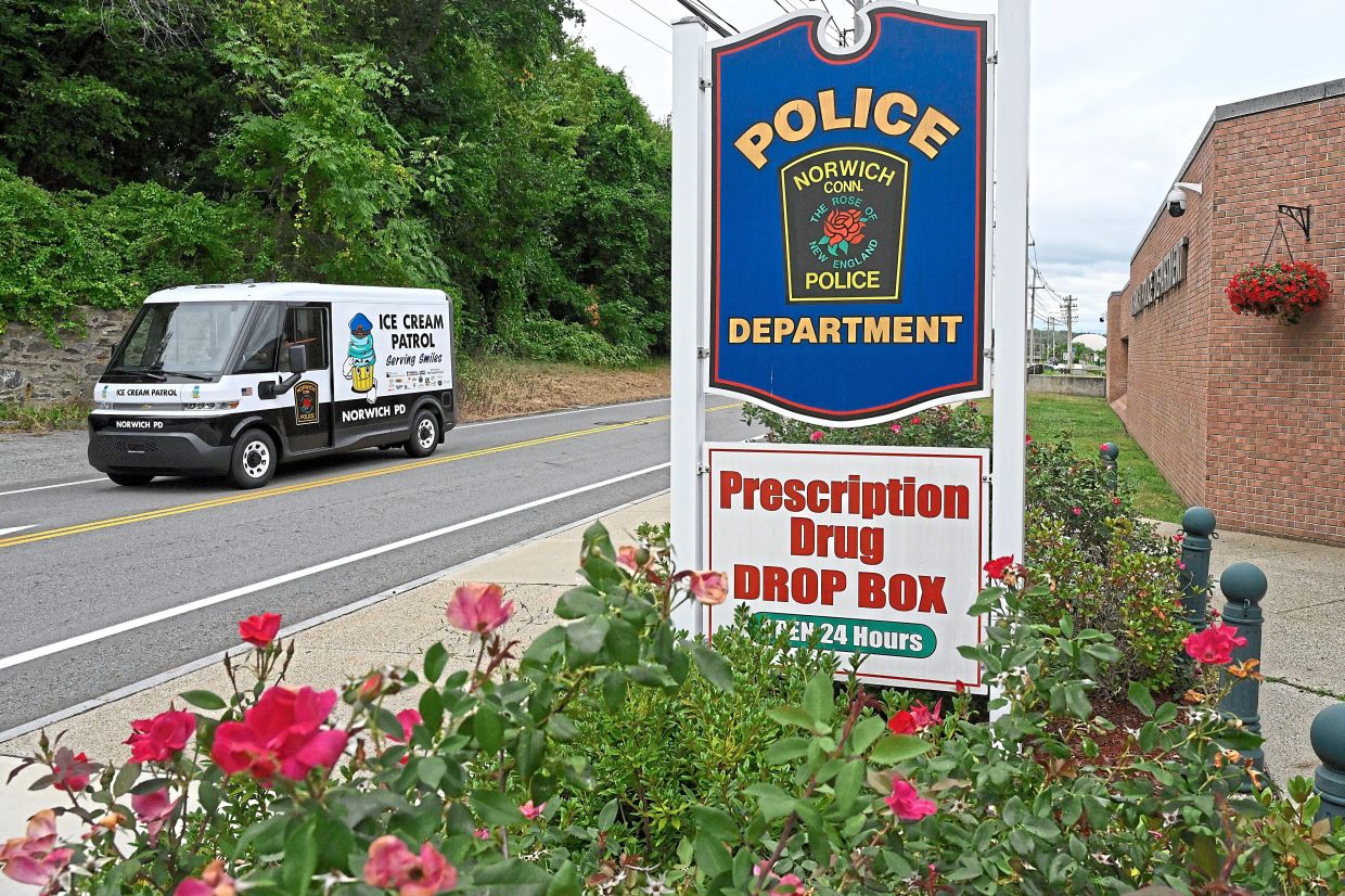The Norwich Police ice cream patrol truck leaves the station on its way to deliver ice-cream to summer campers.
