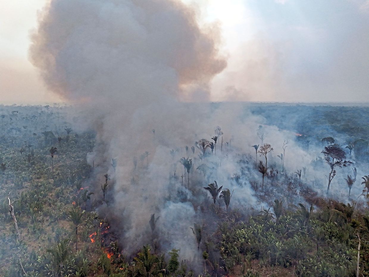 Aerial view of an illegal fire in the Amazon rainforest on the banks of the BR-230 (Transamazon Highway), near the city of Labrea in northern Brazil in September 2024. — AFP