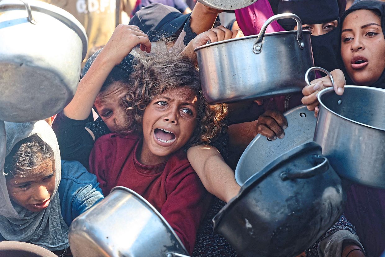 Two years of genocidal war have left Palestinians in Gaza in famine. — AFP