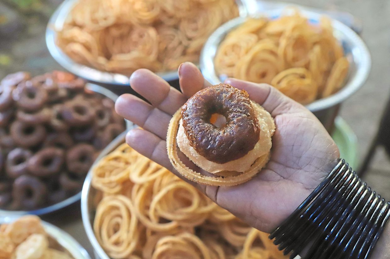 A variety of festive treats for Deepavali, including adhirasam and murukku.