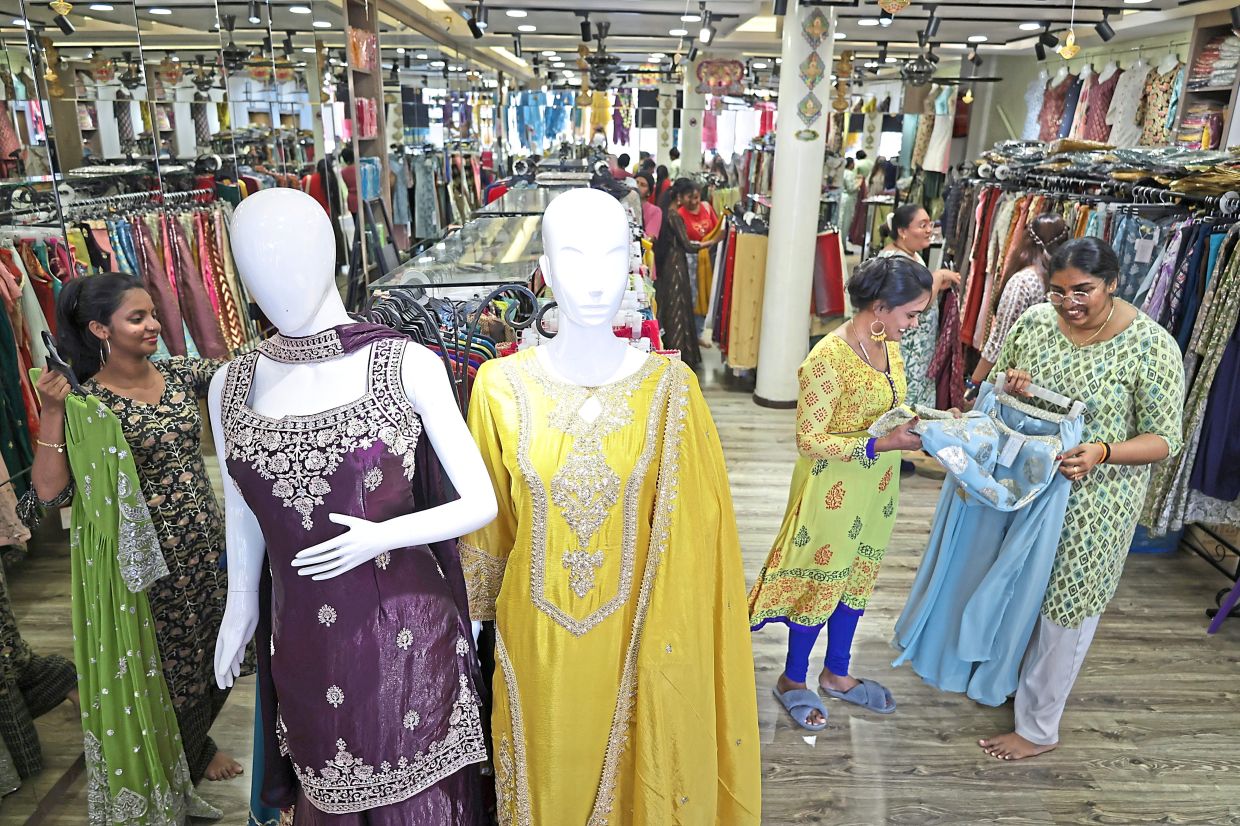 Shoppers looking for clothes at Little India, Penang, as they gear up for Deepavali. — Photos: CHAN BOON KAI/The Star