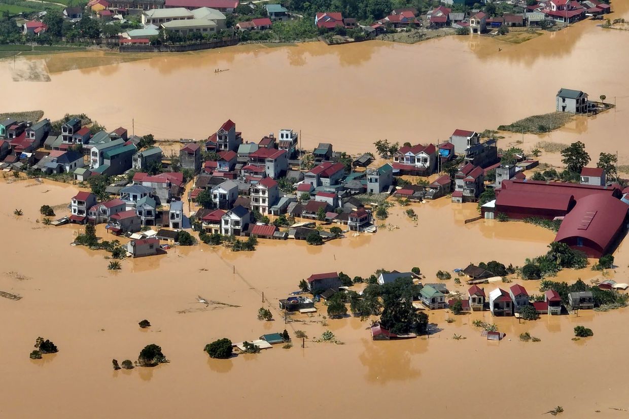 This aerial photo shows a flooded village in That Khe commune after heavy rains caused by Typhoon Matmo in Lang Son province on October 8, 2025. Record floods submerged streets in several communities in Vietnam on Oct 8, with at least eight people killed this week, the government said. - Photo: AFP