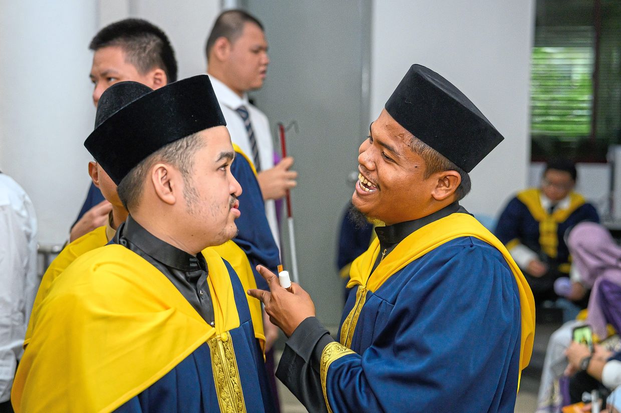 Amirul Mukmin Muhammad Jamil (left) and Muhammad Kamarul Iman A Rahman were among the graduates of the Gurney Training Centre.