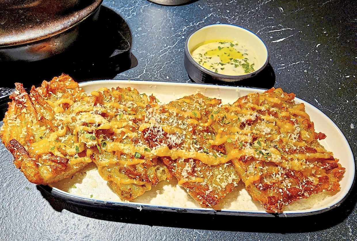Potato pancakes and truffle sauce - a match-made in heaven. — ABIRAMI DURAI/The Star 