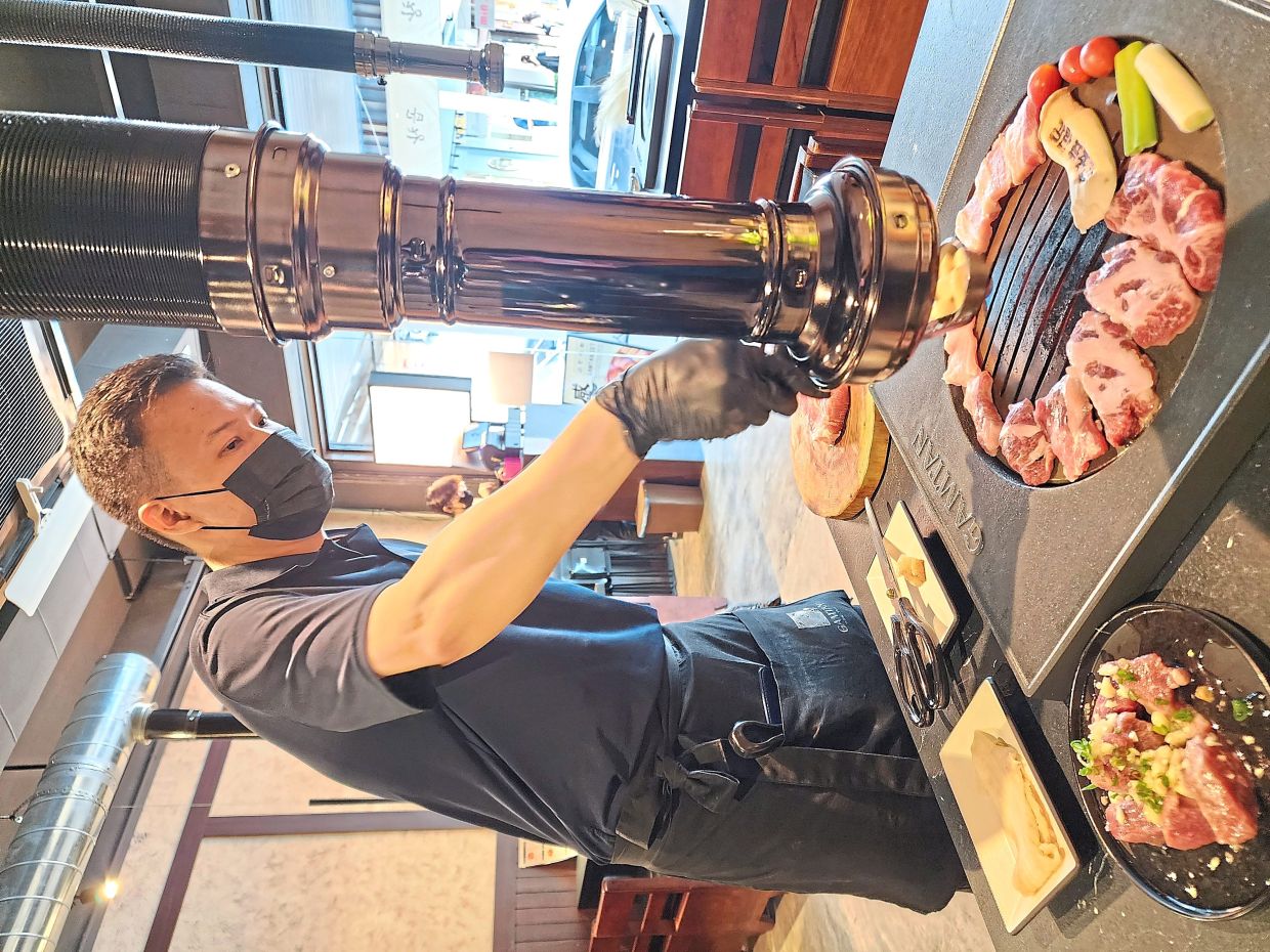At Gamtan Meat Shop, the staff handle the barbecuing to ensure the meat is grilled perfectly. — ABIRAMI DURAI/The Star 