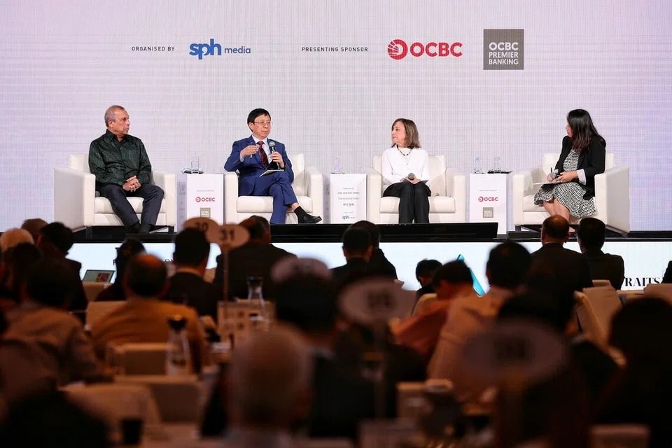 (From left) Ashok Mirpuri, head of international policy and governance at Temasek; Dr Wu Xinbo, dean of the Institute of International Studies and director at the Centre for American Studies at Fudan University; and Wendy Cutler, senior vice-president of Asia Society Policy Institute; at a dialogue moderated by Lianhe Zaobao foreign editor Ng Hui Min during the Asia Future Summit on Oct 9. - Photo: ST