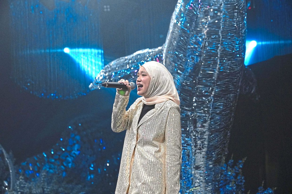 Fatimah can sing in Mandarin. Photo: Arba Ali