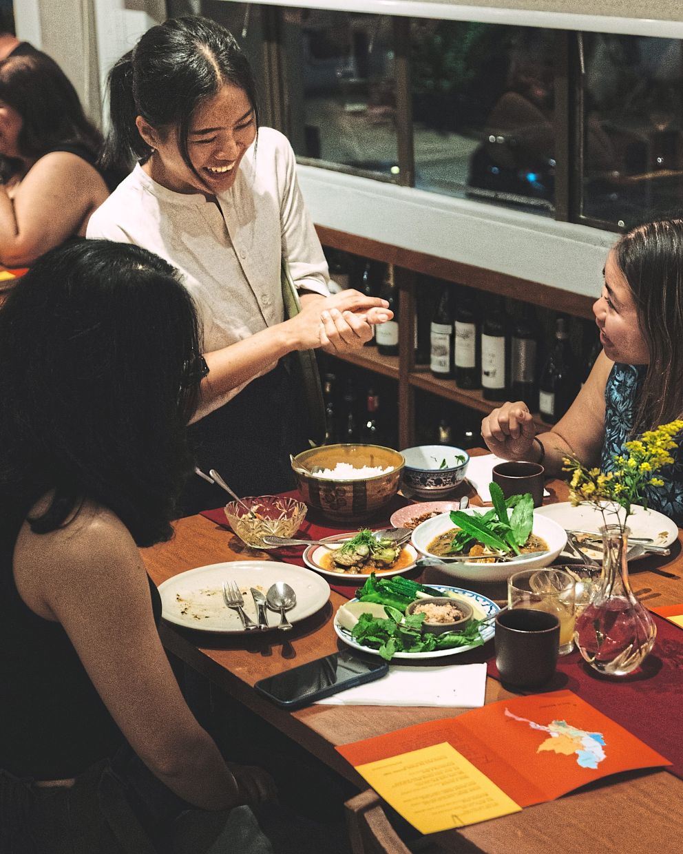 Throughout dinner during the pop-up, Myanmar staff like Nang Kham Lwin (pic) are on hand to explain the cultural nuances behind each dish. — Photos: Table & Apron
