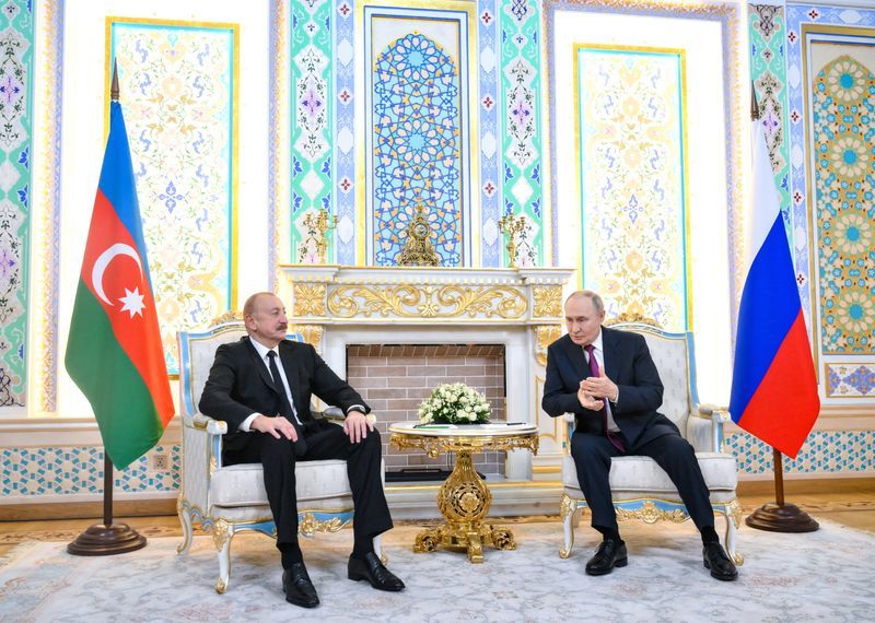 Azerbaijan releases Russian journalist to house arrest after Putin-Aliyev meeting