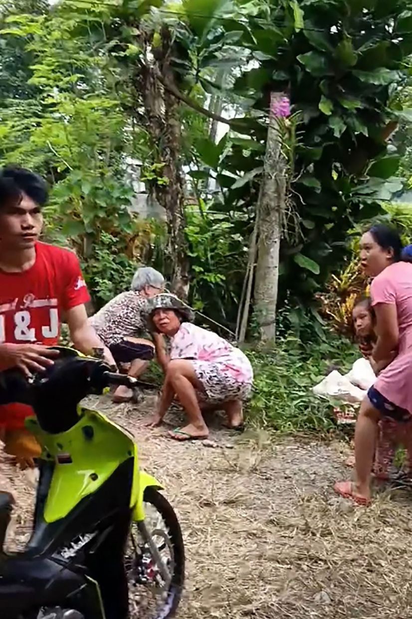This handout screengrab taken from UGC video footage courtesy of Facebook user Glenn Buyan Olan-Olan shows residents reacting as the ground shook during an earthquake in Nabunturan town, Davao. - AFP