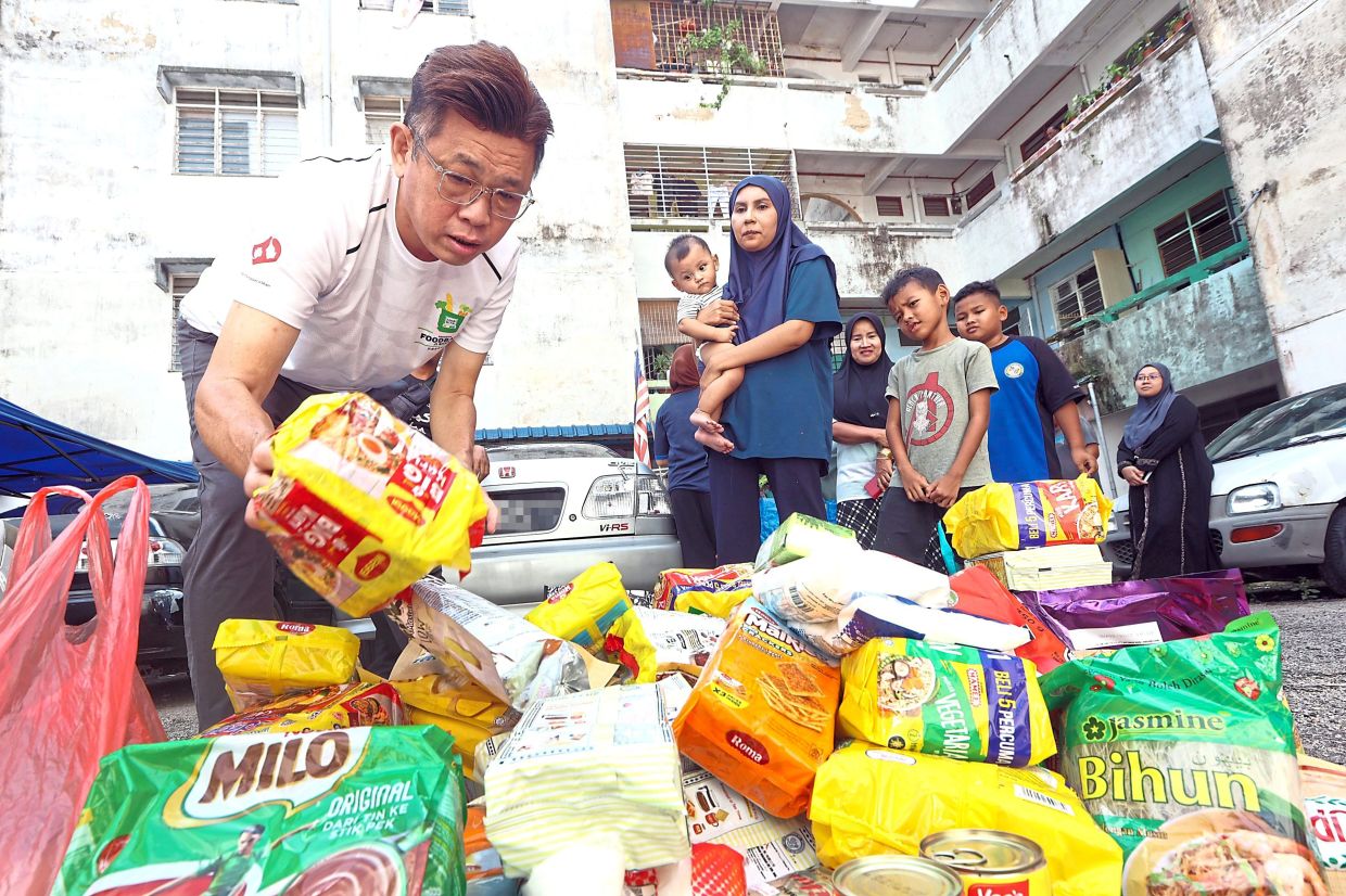 Food banks play an important role in helping underprivileged and low-income households make ends meets. — Filepic and courtesy photos