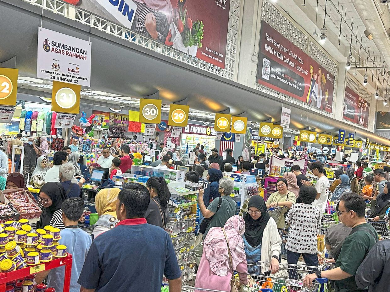 Welcome news: A filepic showing consumers buying items with the RM100 one-off aid from the government. Anwar announced a similar initiative for mid-February 2026.