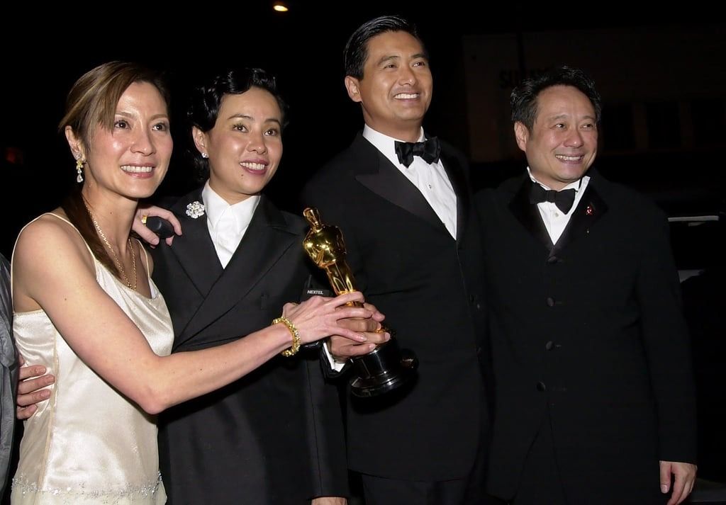 Crouching Tiger, Hidden Dragon actors Chow and Michelle Yeoh (left) hold the Oscar for best foreign language film with Chow’s wife, Jasmine Tan (second left) and the film’s director, Ang Lee, after the Academy Awards in 2001. -- Photo: AP