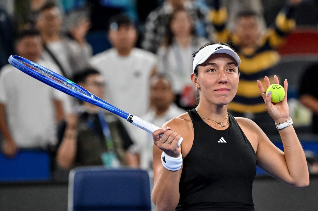 USA star Jessica Pegula celebrates after winning against Belarus top player Aryna Sabalenka in their singles semi-final match at the Wuhan Open tennis tournament in Wuhan, Hubei province in China on Saturday, October 11, 2025. -- Photo by ADEK BERRY / AFP