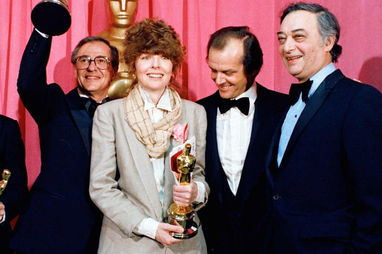 Oscar winners Charles H. Joffe, winner of best picture for 'Annie Hall', left, and Diane Keaton, winner of best actress for 'Annie Hall,' poses with presenter Jack Nicholson, and producer Jack Rollins at the Academy Awards in Los Angeles on April 3, 1978. – Photo: AP