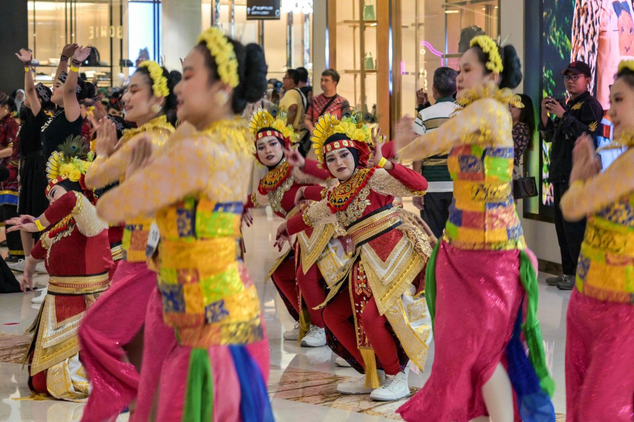 Participants perform during the nationwide dance movement Indonesia Menari 2025 at a mall in Surabaya on Sunday, October 12, 2025. -- Photo by Juni KRISWANTO / AFP