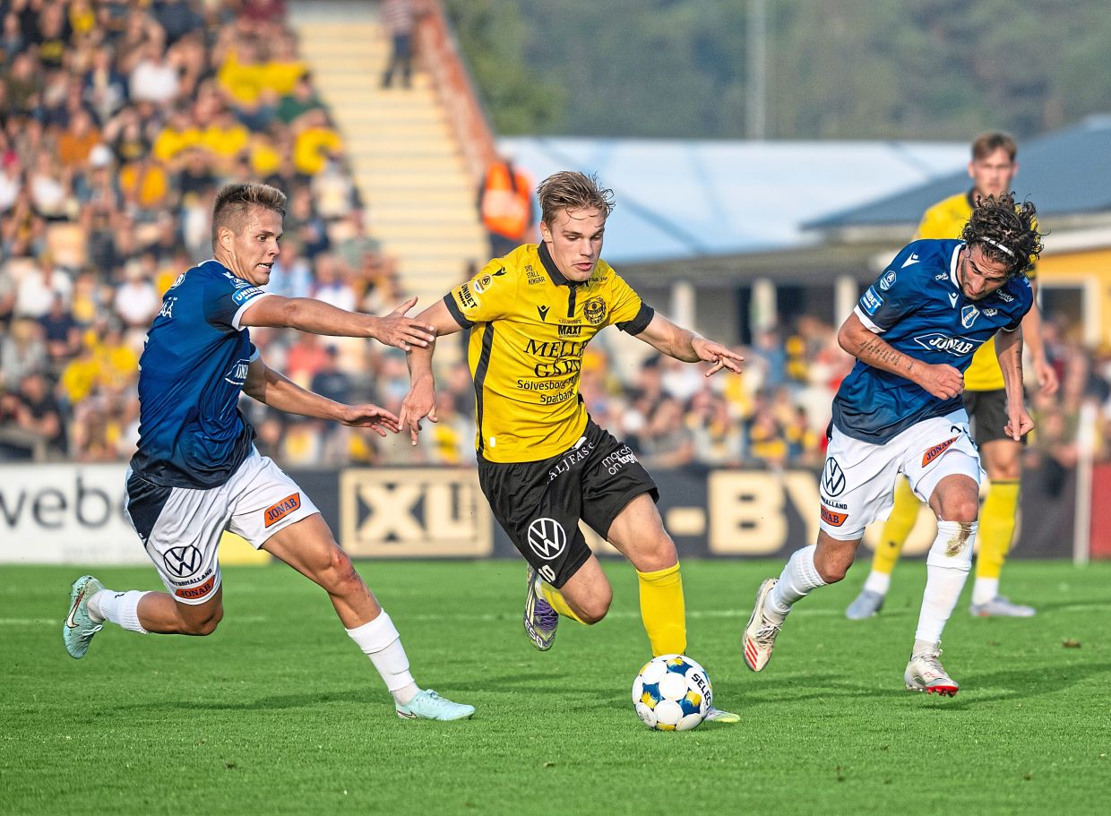 Mjallby’s Jeppe Kjaer Jensen goes past two Halmstad players. — AP