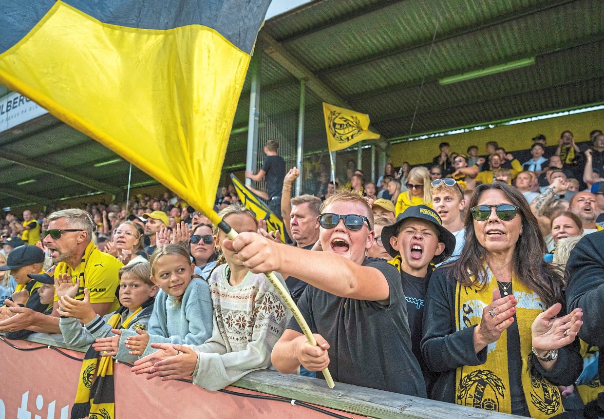 Mjallby supporters at the stand during the match against Halmstad on Aug 30. Mjallby won 1-0. — AP