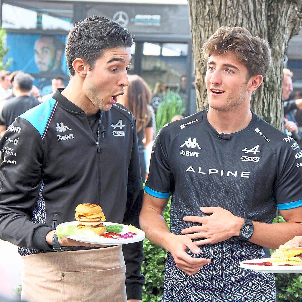Haas’ Esteban Ocon enjoying a burger with Jack Doohan.