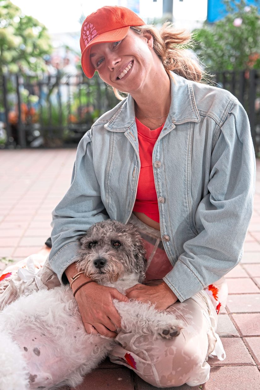 Danielle Collins with her labradoodle, Quincy, at the US Open in New York on Aug 24. At the US Open, players’ dogs are a key part of the entourage, and they have the run of the place. — NYT