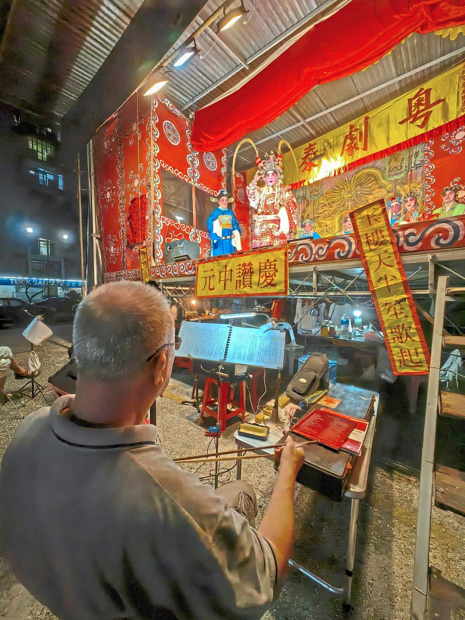 Traditional instruments accompany the New Voice Cantonese Opera during their show in Jalan Bukom.