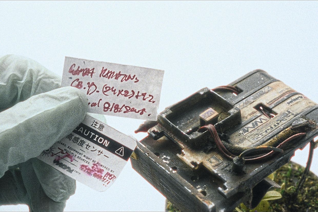 Every robot figurine is crafted with intricate detail – right down to the handwritten notes. Photo: Garrick Tong