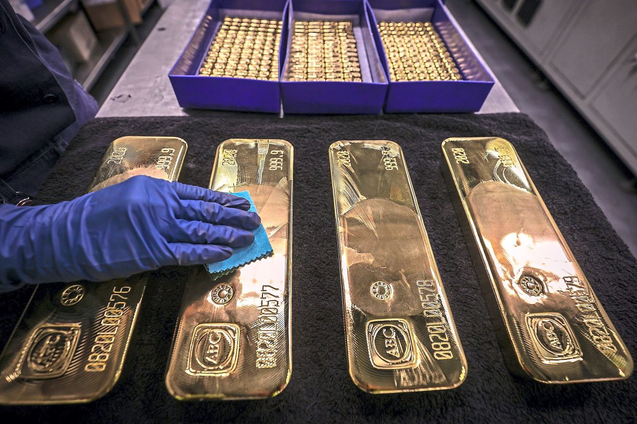 Gold hits record high on US rate cut bets; silver follows suit | The Star
