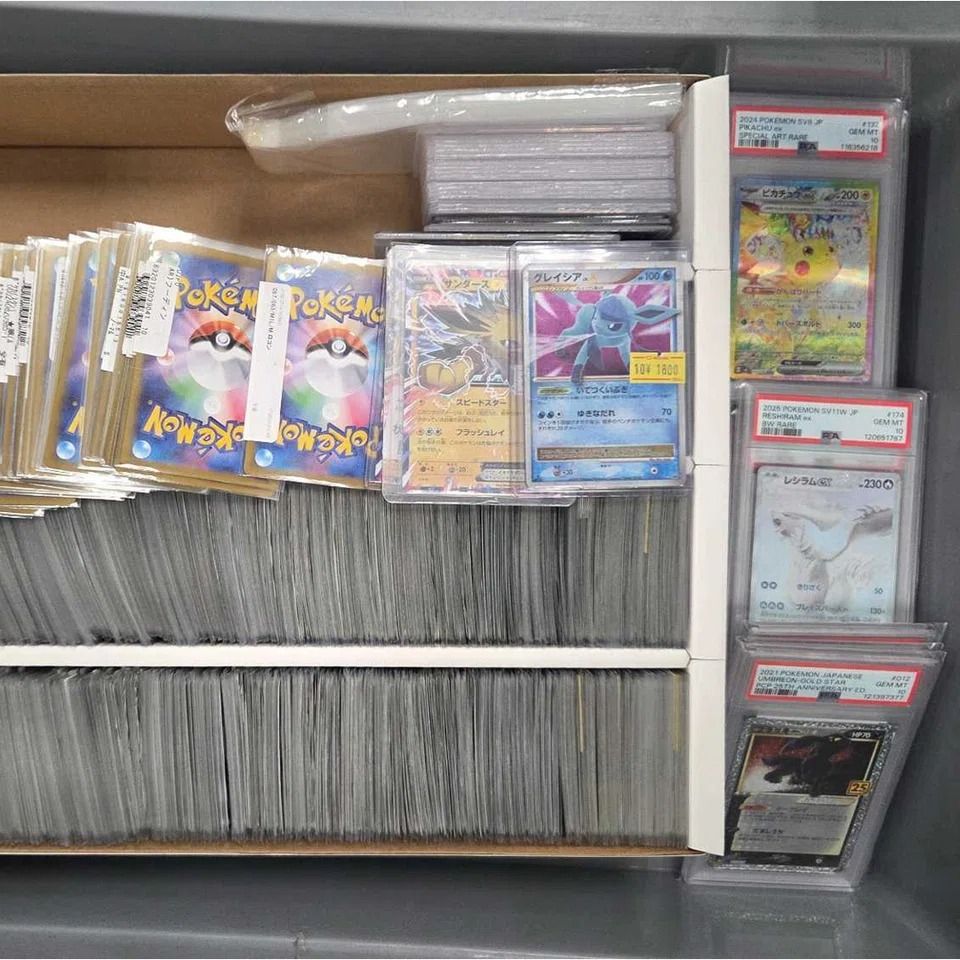 Pokemon trading cards worth more than S$30,000 in total were found in the man’s luggage. - Photos: Immigration and Checkpoints Authority/ Facebook