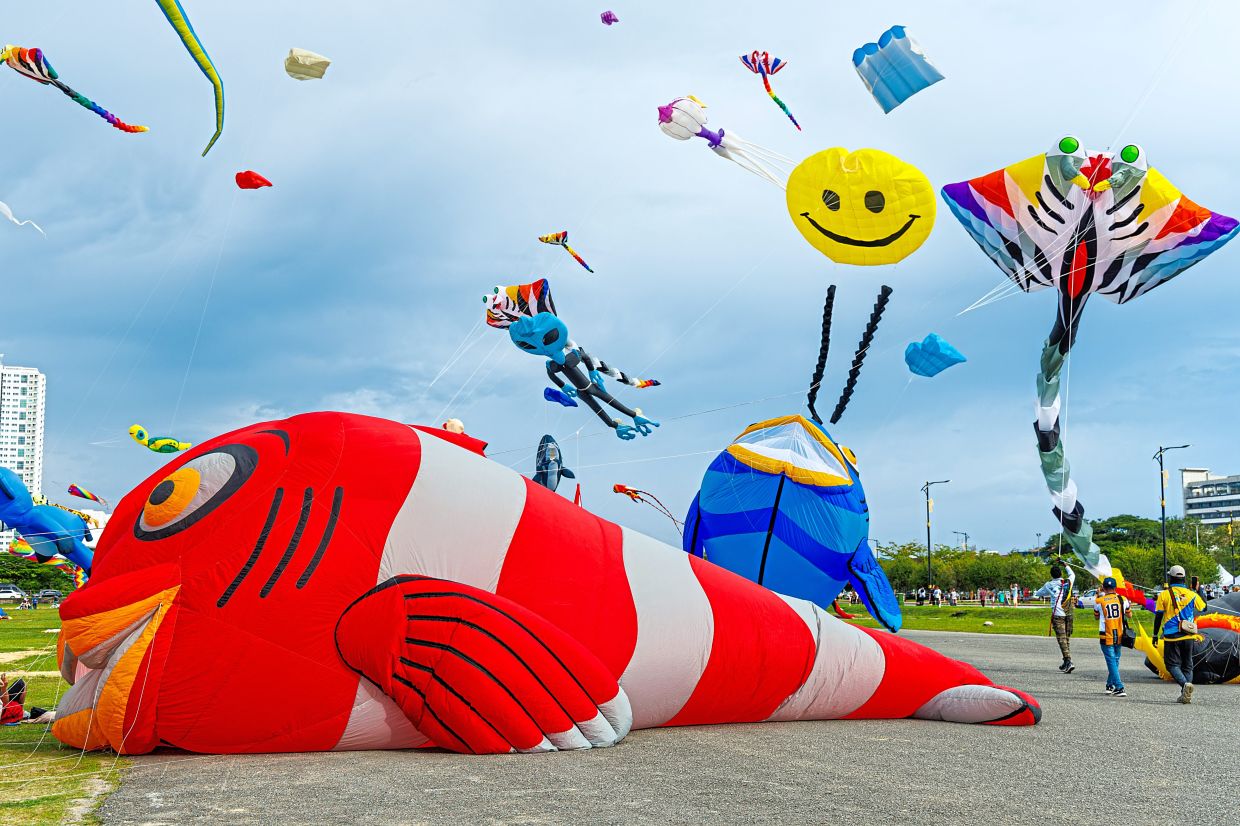 Kites of all shapes and sizes taking flight at the Borneo International Kite Festival in Bintulu.