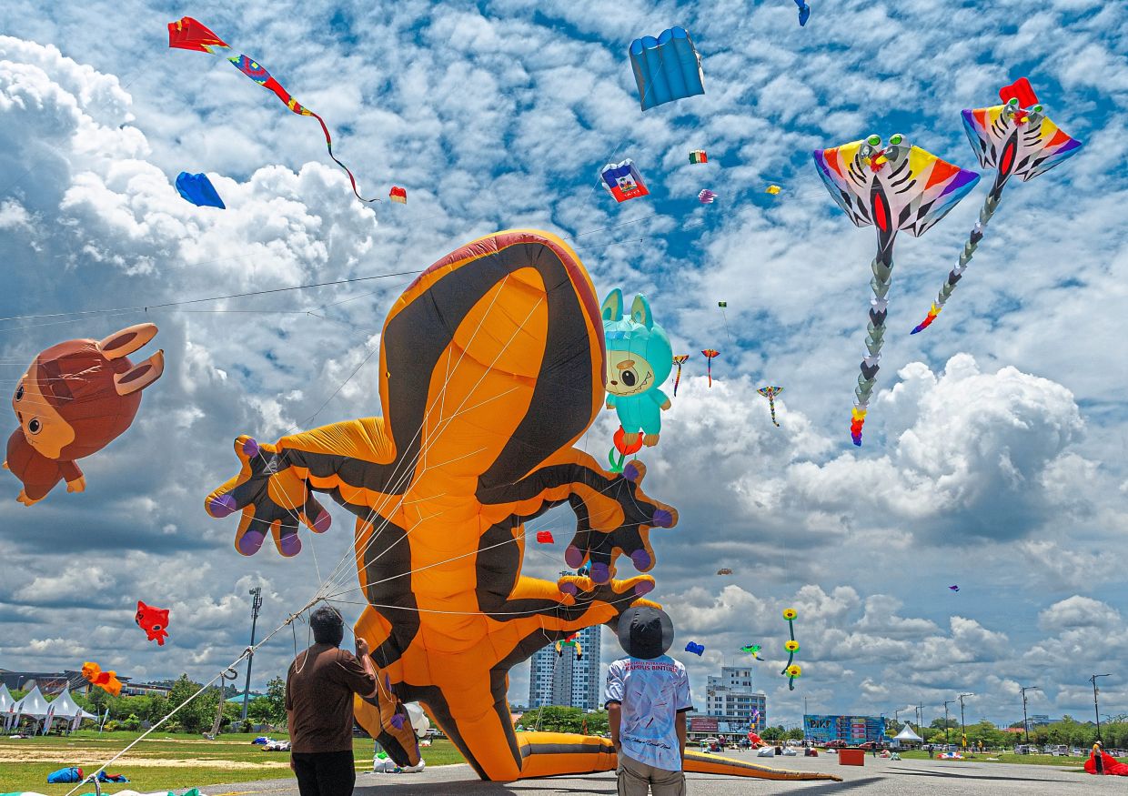 Kites of all shapes and sizes taking flight at the Borneo International Kite Festival in Bintulu.