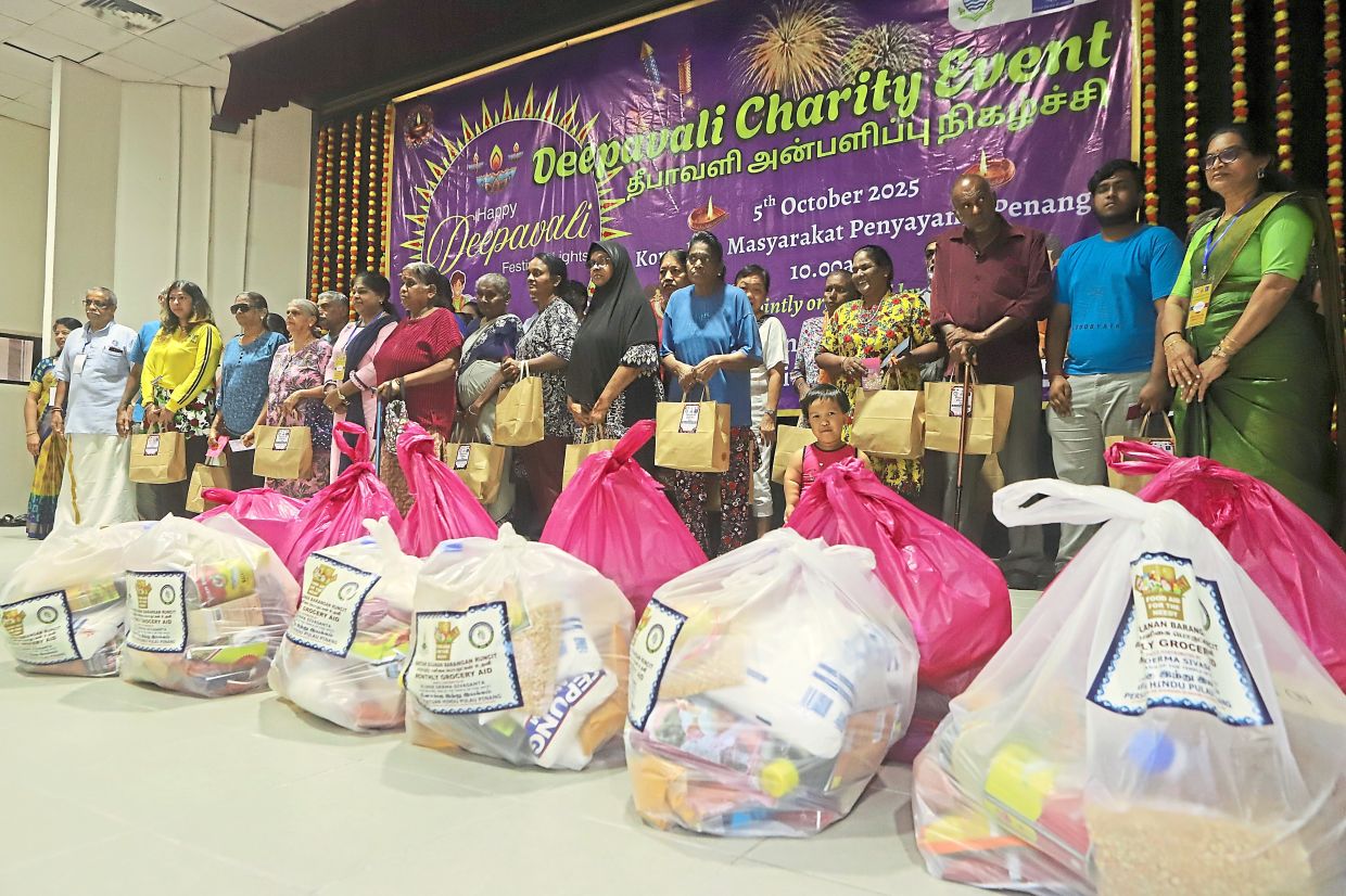 Recipients on stage to collect Deepavali goodie bags during PHA’s Deepavali charity event.