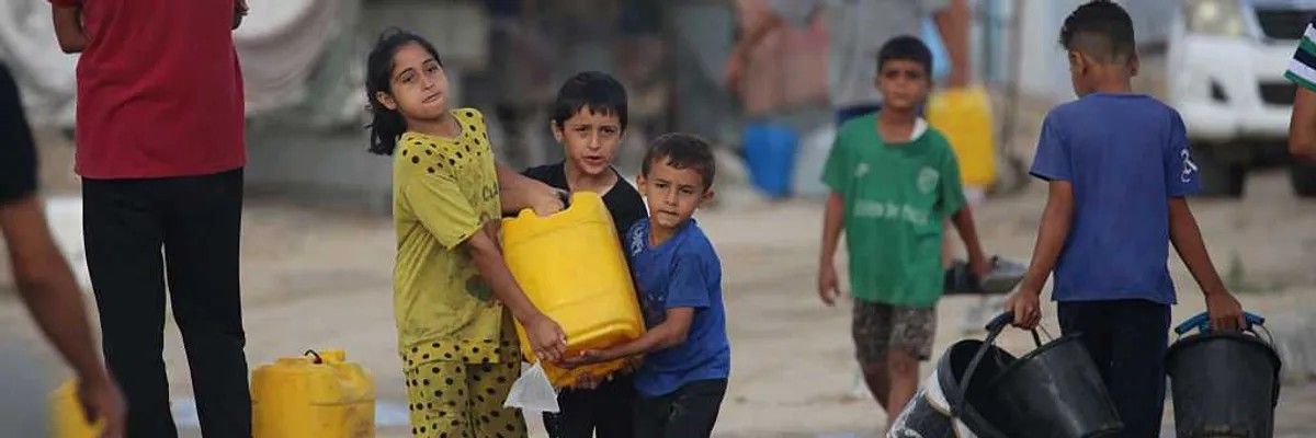 Palestinians first: Displaced Palestinians fill up their jerrycans with drinking water from mobile cisterns at the Bureij camp for refugees in the central Gaza Strip. — Getty images/AFP 