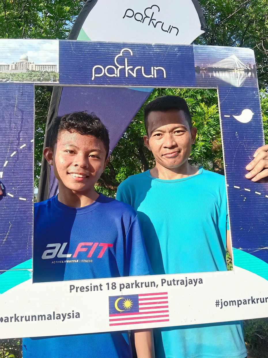 Adi (left) uses parkrun as part of his run training, with the aim of representing Malaysia, while his father Azam runs to keep fit.