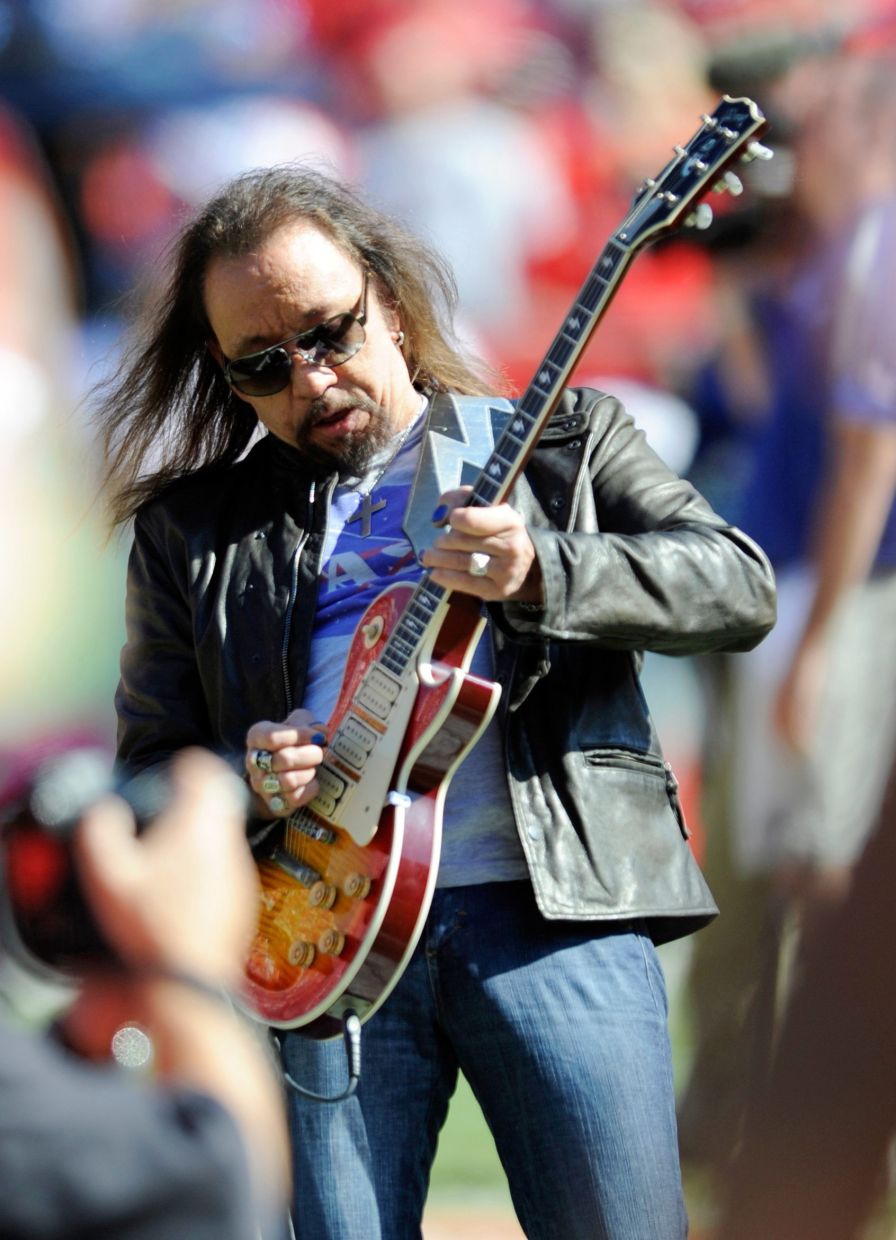 In this Oct. 4, 2009 file photo, former KISS lead guitarist Ace Frehley plays the national anthem before an NFL football game between the Kansas City Chiefs and the New York Giants in Kansas City, Mo. (AP Photo/L.G. Patterson, File)