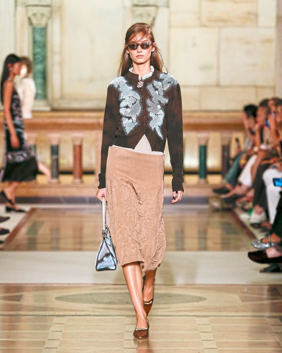This cardigan-and-skirt set has a vintage charm, with meticulously beaded flying birds inspired by an antique tapestry chair. Photo: Tory Burch