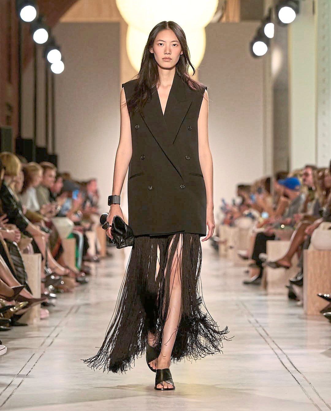 Once a party icon, the fringed flapper dress is modernised as a sleeveless double-breasted blazer with long fringes. Photo: Instagram/Michael Kors