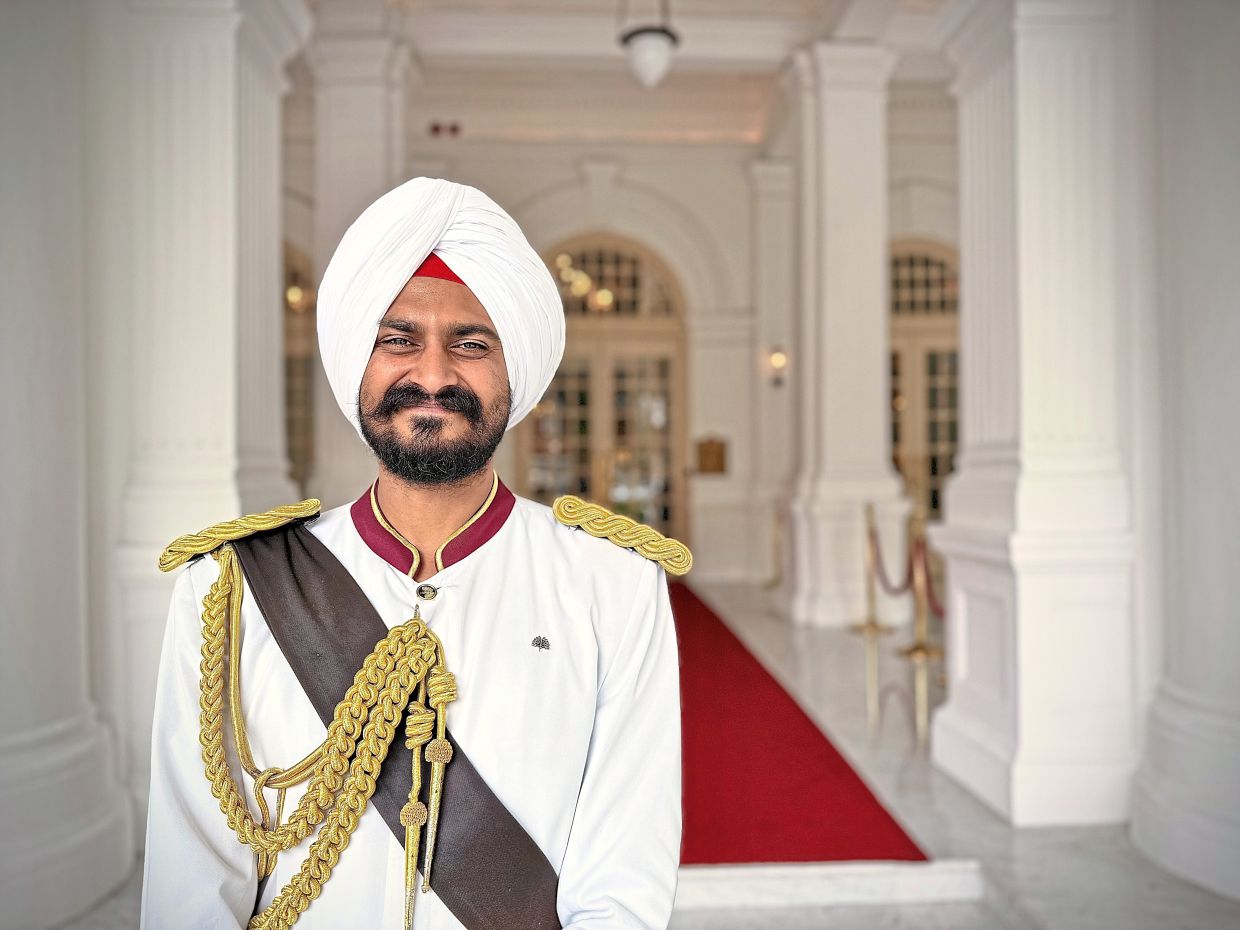 The guards at Raffles Hotel Singapore have become an icon for the hotel.