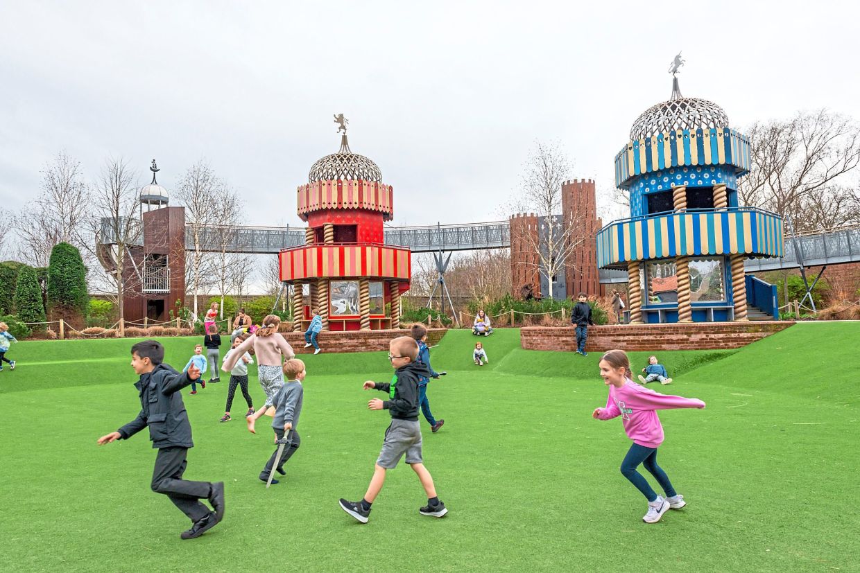 The Magic Garden at Hampton Court Palace in Richmond includes a play structure with towers designed to look like castle battlements. — Historic Royal Palaces